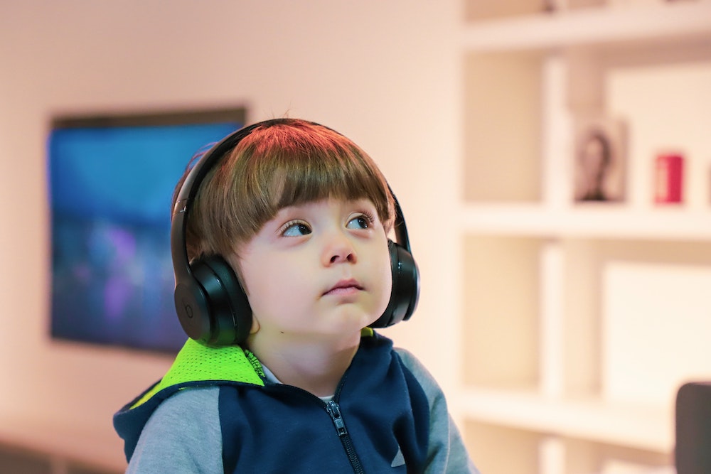 autistic child with headphones on